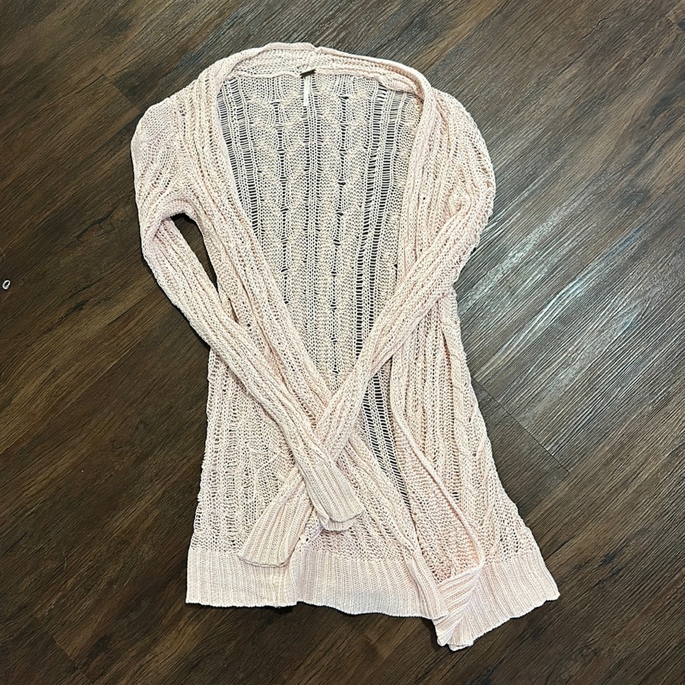 Light pink crochet sweater.